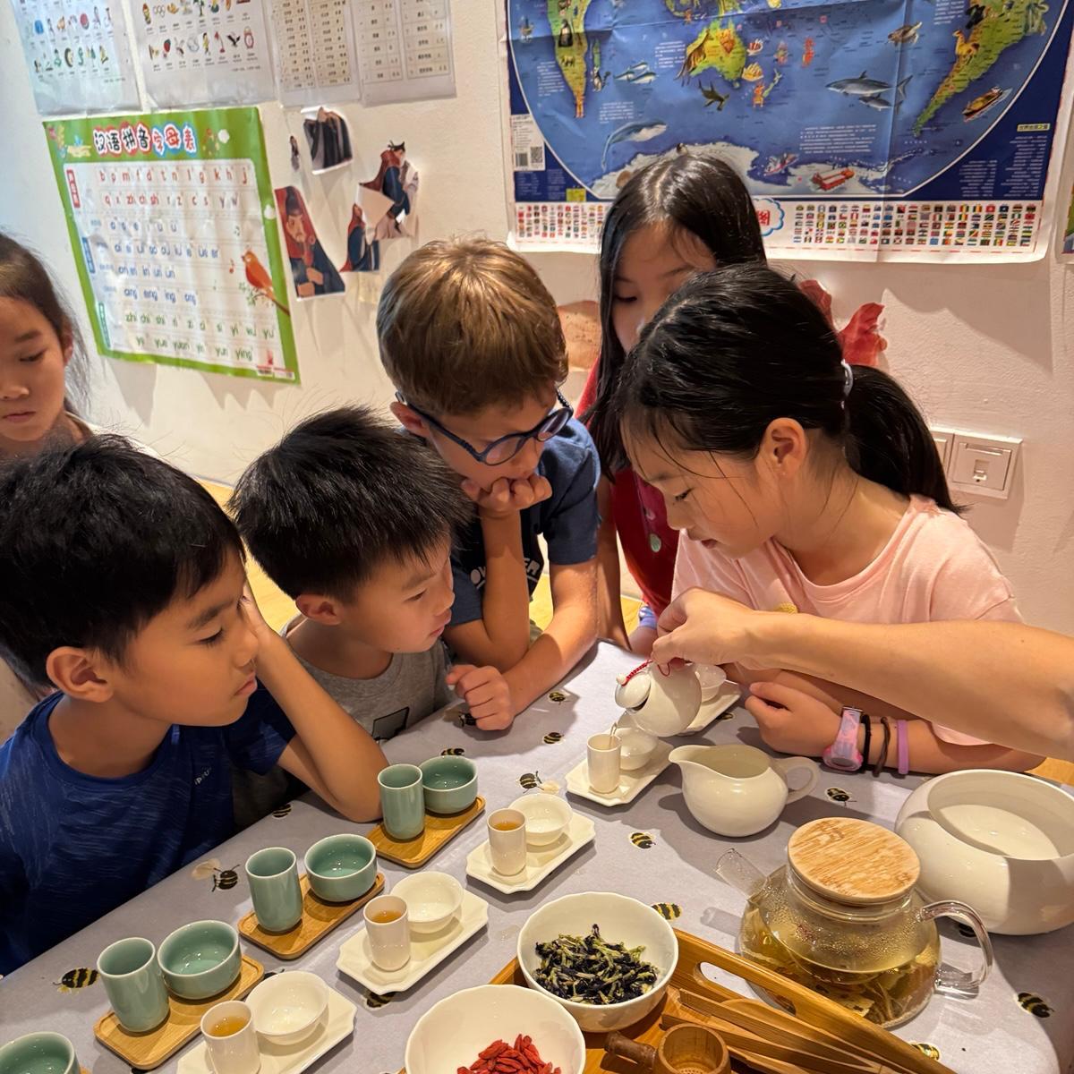 Children learning about Chinese tea ceremony at Haoxue camp